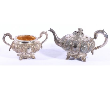 Early Victorian silver teapot and twin handled sucrier of lobed floral embossed circular form, London 1844, Maker WH, 1163 gr