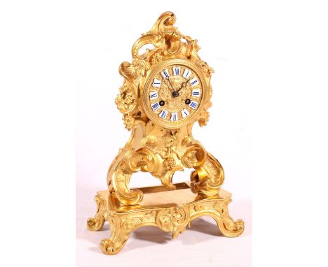 19th century French ormulu mantel clock maker Rainge Freres of Paris of roccoco foliate c-scroll form with Roman plaque numer