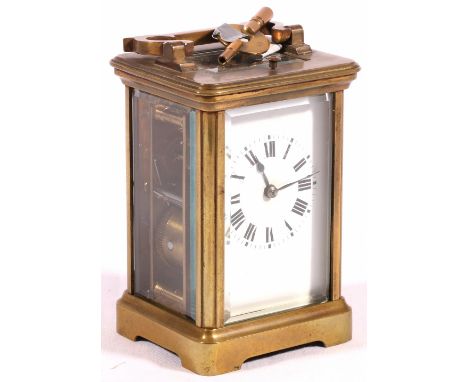 Early 20th Century French brass repeating carriage clock, with Roman enamel dial and compensated escapement to the movement, 