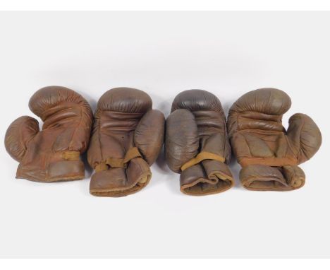 A pair of Frank Bryan boxing gloves, and a pair of Sykes boxing gloves.