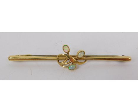 An opal berry spray bar brooch, set in yellow metal, stamped 15ct, 1.8g.