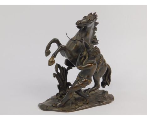 After Guillaume Coustou, a late 19thC bronze cast of a Marley Horse, 18cm high.