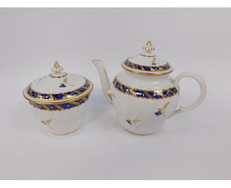 A Worcester First Period porcelain wrythen fluted teapot and sucrier, decorated  in blue and gilt with floral sprigs beneath 