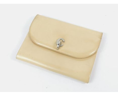 A Christian Dior cream leather clutch bag, with a CD clasp, 23cm long.