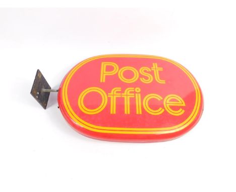 An enamel Post Office oval sign, with wall bracket, 31cm x 44cm.