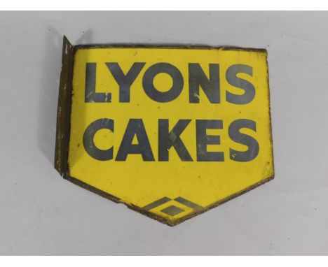 A Lyons Cakes blue and yellow pennant shaped enamel advertising sign, 39.5cm x 44.5cm.