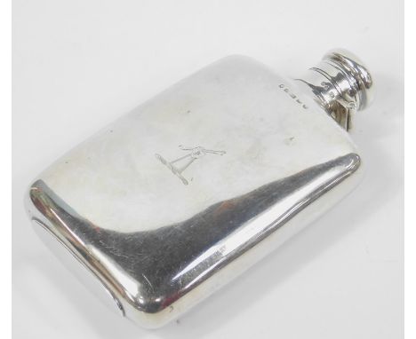 A Victorian silver hip flask by L.G., with shouldered body and hinged lid, the Baines family crest on an oval foot, Birmingha