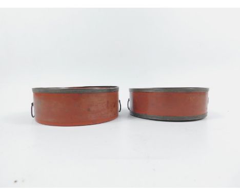 A pair of Georgian red lacquer decanter coasters, with brass fittings, 14cm diameter