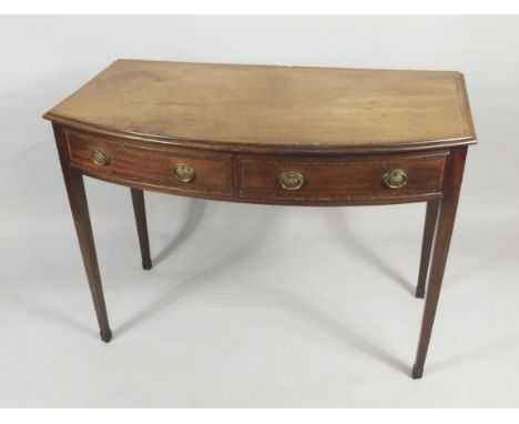 A 19thC mahogany bow fronted side table, with a crossbanded top, above two false frieze drawers and two real side drawers, ea