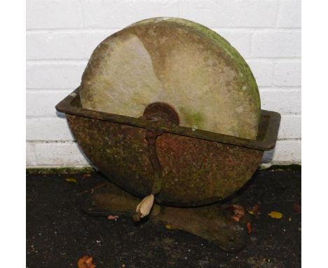 A Victorian stone and cast iron knife grinder, 49cm long.