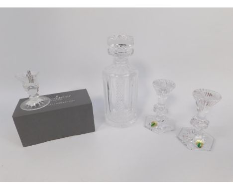 A Waterford cut glass decanter and stopper, and two pairs of candlesticks.