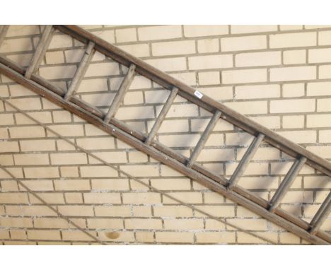 A wooden extending ladder.