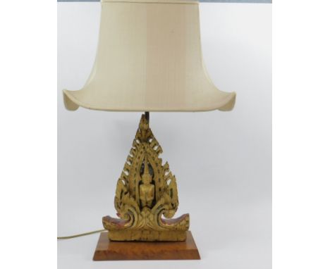 A 20thC carved giltwood Thai figure, converted to a lamp.