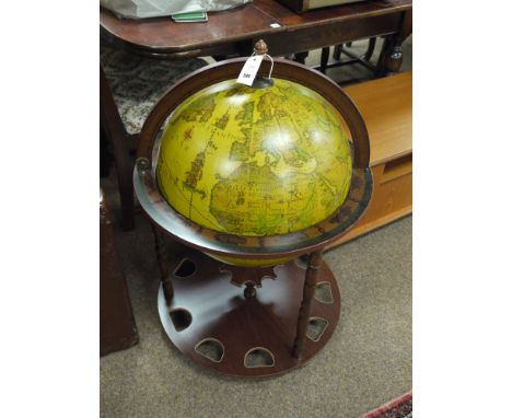 A modern terrestrial globe on stand (cocktail cabinet).