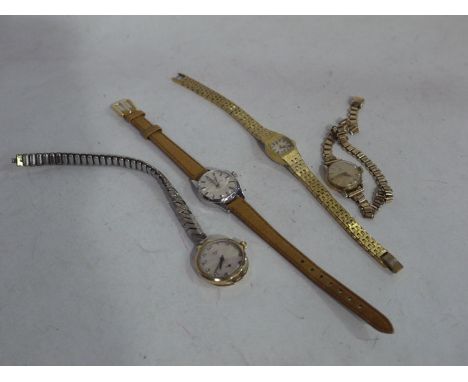 An Omega gold cased cocktail watch, with 9ct. link strap; together with another gold cased pocket watch by Magno; a Rotary co