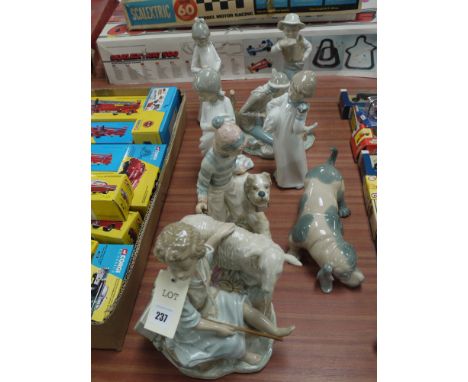 A collection of eight Spanish Lladro style ornaments, various.