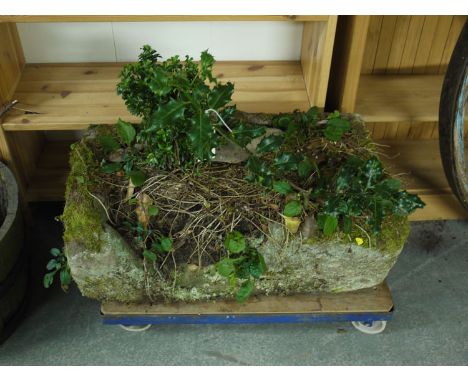 A large rectangular stone trough (part of side missing).