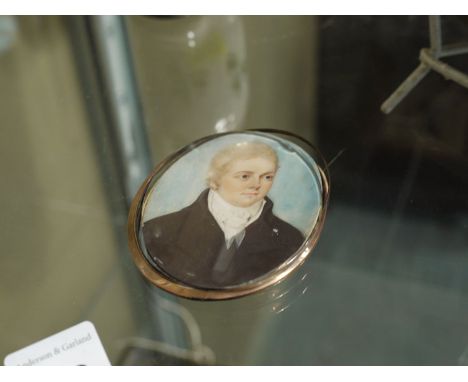 19th Century British School - A miniature bust portrait of Andrew Burt J.P., bodycolour on ivory.