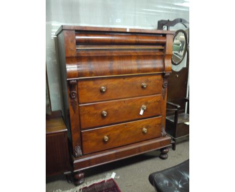 A Victorian mahogany Scotch chest, fitted a combination of five long drawers with turned handles, fitted decorative corbels, 