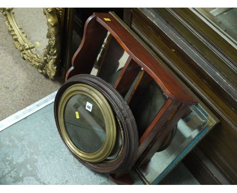 A 1930's rectangular bevelled wall mirror in blue and gold frame; an oval mirror; a circular mirror; and a small three-tier w