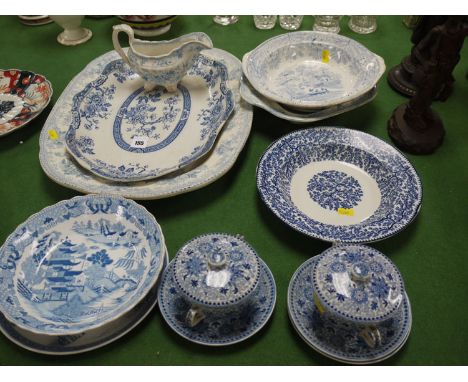 A collection of miscellaneous blue and white china, comprising: two meat plates; various bowls; a pair of two-handled cups wi