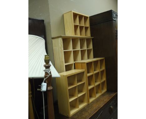 Four small wooden shelf units, various sizes.