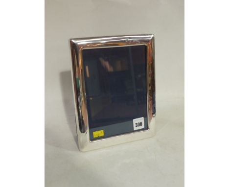 A silver mounted photograph frame, by R. C. Sheffield 1989, of plain design.