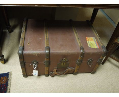 A 19th Century leather cabin trunk with brass clasp; together with a canvas covered trunk with wooden and metal bindings.  (2
