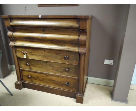 A Victorian mahogany Scotch chest of five drawers, the top two with shaped fronts, the three bottom graduating drawers fitted