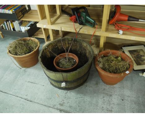 Three modern pots; and a metal-bound wooden planter.