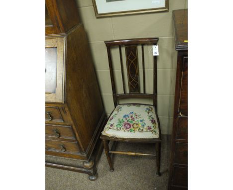 An Edwardian inlaid mahogany bedroom occasional chair; an oak occasional chair with pierced vase-shaped splat and tapestry up