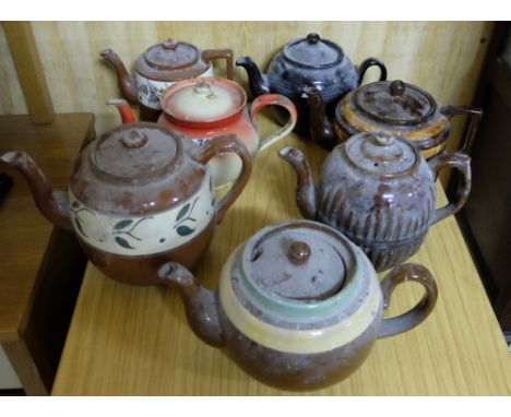 Shelf of old painted pottery teapots & 1 enamel teapot (7)