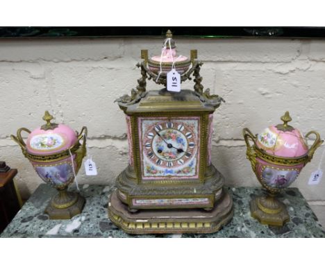 French gilt metal and ormolu mounted Mantle Clock, with Sevres style porcelain plaques, mounted with an urn and profusely han