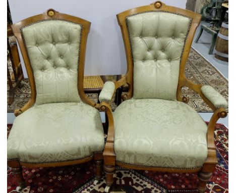 Pair of Victorian Mahogany Ladies & Gents Armchairs, inlaid with satinwood, the pediments featuring rosette motifs, on round 