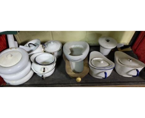 Shelf of enamel ware – toilet pans & toilet bowls etc