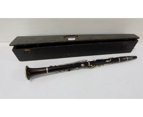 Early to mid-20thC ebony handled Clarinet (26”l) with plated mounts, with original wooden carrying case, 2 spare mouthpieces