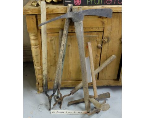 6 Assorted farm tools, including  – 1 small sledge hammer, 2 pinchers, 3 pick axes 