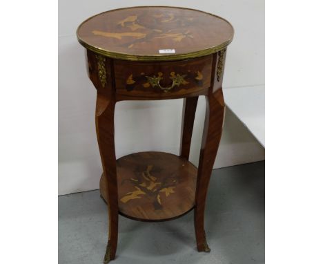 Kingwood Lamp Table, the brass banded circular top over a drawer and a stretcher shelf, on sabre legs, brass mounts, 18” dia 