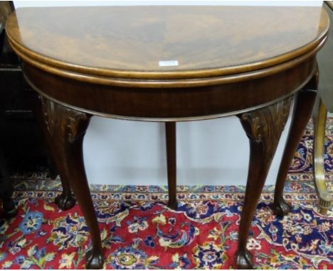 Early 20thC Mahogany Waring and Gillow Foldover Card Table, demi-lune shaped front, on scroll shaped front legs, ball and cla