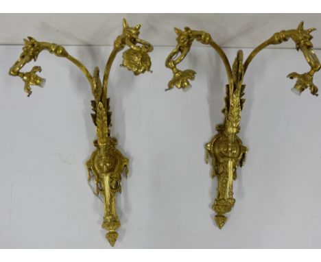 Matching Pair of Gilt Brass Wall Lights, each with two drop light fittings supported by dogs heads and brass rings, 23”high, 