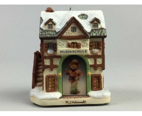 LOT OF HUMMEL CHRISTMAS TREE ORNAMENTS AND FIGURES,modelled in the form of German shopfronts and town buildings and child fig