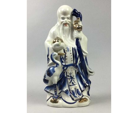 CERAMIC FIGURE OF SHOU LAO, 30cm high, along with another Chinese figure of a scholar, a brass Buddha, a decorative plaque an
