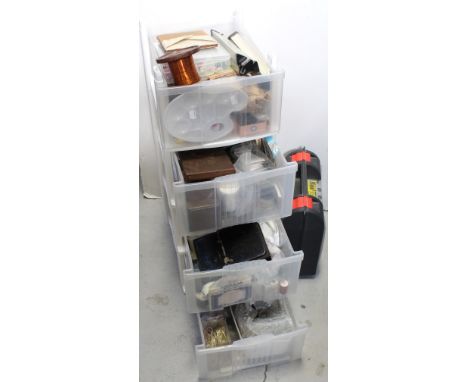 A plastic floor-standing four-box container with a large quantity of  craft ware to include fabric paints, beads, embellishme