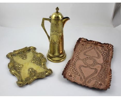 A c1900 ornate Art Nouveau brass tray, 30 x 23cm, a vintage ornate Art Nouveau style brass ewer, height 32cm and an Arts and 