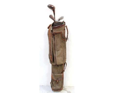 A small collection of vintage hickory-shafted golf clubs to include three wedges and a Tom Morris Lady Driver, all contained 