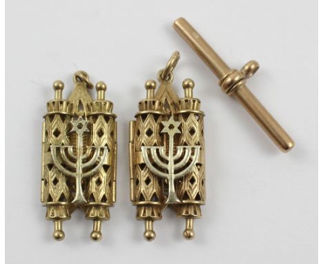 Two 9ct gold charms in the form of Sephardic Torah cases and a 9ct gold T bar for an Albert chain, approx combined 17.2g (3).