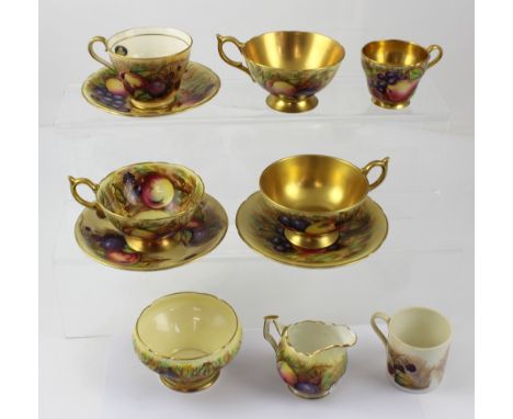 A group of Aynsley printed and hand-painted ware decorated with autumn fruits, some gilt-heightened, to include cups, saucers