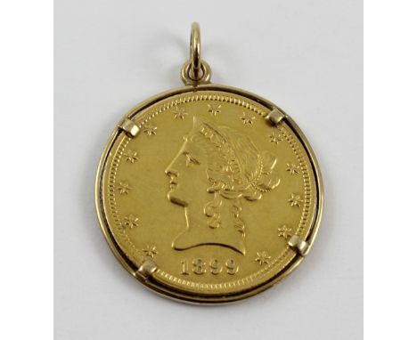 A United States ten-dollar gold coin, 1899, in a 9ct gold mount, approx 18.3g.