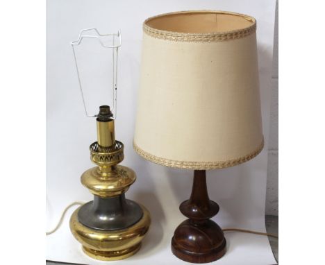 A brass and white metal table lamp in the form of an oil lamp, height 38cm and a turned wooden table lamp (2).