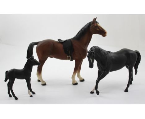 Three ceramic horses to include a large stallion with white socks (af), height approx 26cm, a black stallion with one white s